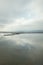 Cloudscape reflecting on quiet wetlands lake water in Camargue, France