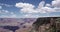 Cloudscape in scenic canyon. Clouds moving along over top of beautiful scenic mountains of pink colors. Time lapse