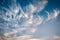 cloudscape with white altocumulus clouds at evening