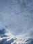 cloudscape with white altocumulus clouds at evening