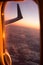 Cloudscape of window at flying airplane