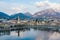 Cloudy aerial cityscape of Lecco town on spring evening. Picturesque waterfront of Lecco town located between famous Lake Como and