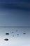 Cloudy blue minimalist seascape. Deserted space. Horizon line.