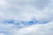 Cloudy blue real sky with light grey clouds. The blur sky background, high resolution 3