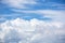 Cloudy and blue sky for background. nature background white cloud and blue sky view from airplane windows.