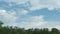 Cloudy in blue sky moving high above trees and mountains, cumulonimbus clouds landscape in beautiful colourful summer day.