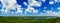 cloudy blue sky over gently rolling patchwork farmland