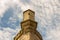 Cloudy blue sky and symmetrical building detail