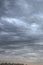 Cloudy cityscape with heavy sky over the roofs of buildings