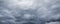 Cloudy dark stormy sky panorama. Natural background