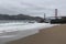 Cloudy day on the Beach looking at the Golden Gate Bridge