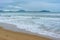 Cloudy day, sand deserted beach of the coast of Haitang Bay in South China Sea. Sanya, island Hainan, China. Nature Landscape