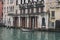 Cloudy day in Venice. White boat moored near the house. there is a free parking place. Venice. Italy