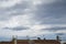 Cloudy day view traditional house roof with chimney