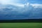 Cloudy field fields in the spring