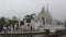 Cloudy foggy morning at the White temple. Chiang Rai, Thailand