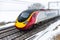 Cloudy foggy winter day view of Train on UK Railroad in England. Emma storm railway landscape.