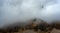 Cloudy fogy sky mountain peak covered in mist in the morning. Teleferic cable car . Dolomite alps