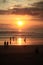 Cloudy golden sunset light reflection in Kuta Beach, Bali, Indonesia