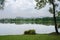 Cloudy lake shore in city after rain