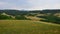 Cloudy landscape with hills, forests and meadows above town of Slovenska Lupca