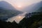 Cloudy landscape view of sunset over Indus river and layers of Karakoram mountain range, Pakistan.