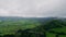 Cloudy mountain peaks landscape cinematic drone view. Countryside greenery hills