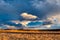 Cloudy pastel blue sky over a prairie