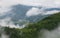 Cloudy Rural Mountain Landscape With Summer Morning Fog In Matisesti Area Of Apuseni National Park, Romania. Beautiful Countryside