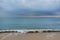 Cloudy seascape on a golden sandy beach on Tarifa coast before storm. Natural minimalist background