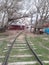 Cloudy skies springtime landscape, barn and rail road tracks behind Terry Bison Ranch Cheyenne Wyoming