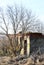 Cloudy sky above the abandoned ruined brick house, dry grass