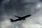 Cloudy sky and airliner silhouette