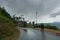 Cloudy sky and curve of Himalayan road, monsoon landscape of Garhwal, Uttarakhand, India. Climate change effect on Himalays