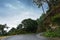 Cloudy sky and curve of Himalayan road, monsoon landscape of Garhwal, Uttarakhand, India. Climate change effect on Himalays