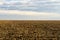 Cloudy Sky Over Harvested Land