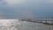 Cloudy sky over the lake Balaton in Hungary. Metal pier in the water