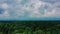 Cloudy sky over Styrian forest in Austria, aerial crane shot 4k.