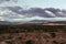 Cloudy sky over the valley with wild plants at the Tatacoa Desert, Colombia  at sunset