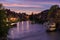 Cloudy sky at sunset, Regnitz river with ships in Bamberg