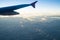 Cloudy sky under the wing of an airliner