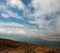 Cloudy sky and view on the isle from Lanzarote