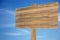 Cloudy sky with wooden sign