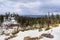 Cloudy spring day with snow covering the Sierra Mountains, Lake Tahoe in the background; Van Sickle Bi-State Park; California