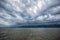 Cloudy storm in the sea before rainy. Tornado storms cloud above the sea.