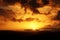 Cloudy sunset above desert mountains