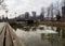 Cloudy winter day on a river with floating ice floes overlooking high-rise buildings and Exchange Bridge in the central part of