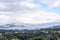 Cloulds and mist over rolling hills in spring time, coastal live oaks in Julian California landscape