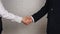 Clouse-up of businessman and businesswoman shaking hands