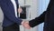 Clouse-up of businessman and businesswoman shaking hands